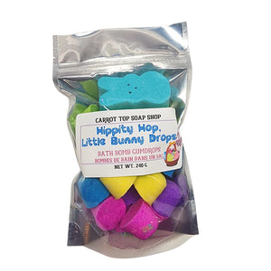 Photo of a pouch of bath bomb gumdrops. They feature multi colours and a mini bunny bath bomb.